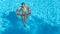 Acrive girl in swimming pool aerial top view from above, kid swims on inflatable ring donut , child has fun in blue water