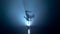 Acrobat girl i holds her body in the air with one hand. Smoke background. Silhouette