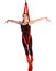 Acrobatic girl exercising on red fabric rope