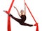 Acrobatic gymnastic girl exercising on fabric rope