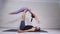 Acrobatic yoga. Young woman and man performing exercises. The combination of acrobatics and yoga