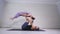 Acrobatic yoga. Young woman and man performing exercises. The combination of acrobatics and yoga