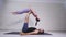 Acrobatic yoga. Young woman and man performing exercises. The combination of acrobatics and yoga