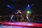 Acrobats perform exercises on the bar in the Circus arena.