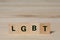 Acronym lgbt written on wooden block with copy space
