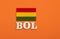 Acronym in wooden letters of the name of the country Bolivia with its respective flag