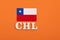 Acronym in wooden letters of the name of the country Chile with its respective flag