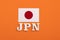 Acronym in wooden letters of the name of the country Japan with its respective flag