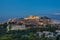 The Acropolis of Athens with lights on at dusk
