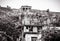 Acropolis of Athens and old houses in Plaka district, Greece. Vintage view of ancient street in Athens city center in black and