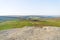 Across flat gritstone rock on Higger Tor to the ancient Carl Wark fort