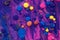 Acrylic paint balls abstract texture. Purple, blue and yellow liquids mix. Creative multicolor background. Bright colors