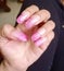 Acrylic pink color glittered nails