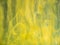 Acrylic yellow smoke swirling under water, abstract background. Close up view. Blurred background. Acrylic light clouds