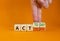 Act today not tomorrow symbol. Businessman turns wooden cubes, changes words act tomorrow to act today. Beautiful orange table,