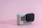 Action camera isolated on pink background. Video & Photo Camera