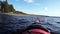 Action camera: slow paddling on summer Scandinavian lake towards rare grass, Stocksjo, Umea, Vasterbotten, Sweden