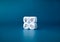 The action plan, business target icons on white dice cube blocks stack on blue background, minimal style.