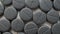 Activated charcoal carbon pills placed on rotating table, close up