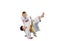Active athletes in judogi are doing throws judo