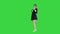 Active attractive girl walking by and dancing on a Green Screen, Chroma Key.