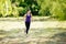 Active attractive running young woman outdoor. Workout in the park, forest, nature.