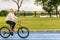 Active blond woman riding a bicycle