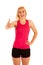 Active blonde sporty woman shows thumb up as a gesture for success