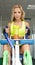 Active blonde woman in sportswear sitting on the sports equipment. Gym. Sports nutrition. Amino acids. look.