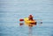 Active boy, having fun enjoying adventurous experience kayaking on the sea