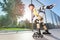 Active boy in helmet rollerblading at skate park