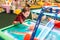 Active boy plays air hockey, entertainment center