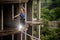 Active and brave young woman balancing on a slackline