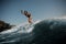 Active brunette woman wakesurfing on board down the blue wa