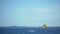 Active couple parasailing, smiley parachute flying above sea surface, good mood