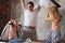 Active delighted family enjoying pillow fight at home