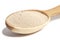 Active dry baking yeast granules in wooden spoon