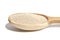 Active dry baking yeast granules in wooden spoon