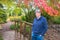 Active Elderly Man in Autumn Rain in Park