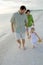 Active family playing on beach