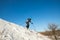 Active female skiing downhill in winter forest