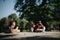 Active females enjoying pre-workout exercises in a sunny city park.