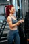 Active fit woman doing gym workout, working muscles with hard biceps workout. Fitness and sports concept