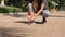 Active Fit Young Mixed Race Runner Girl Tying Shoe Laces in Park. 4K. Bangkok, Thailand.