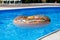 Active games on water, vacation, holidays concept. Chocolate donut. Cool fun summer holidays