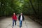 Active handsome senior walking with his daughter