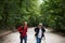 Active handsome senior walking with his daughter