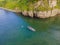 Active happy family having fun together enjoying adventurous experience kayaking on the sea on a sunny day during summer