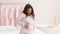 Active and healthy pregnancy. Young carefree happy pregnant woman in pajamas dancing at home, enjoying music