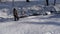 Active healthy small kid in winter clothes running through snow making snowball near river with fun